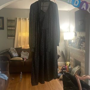 Black dress , white polka dots with tie around.